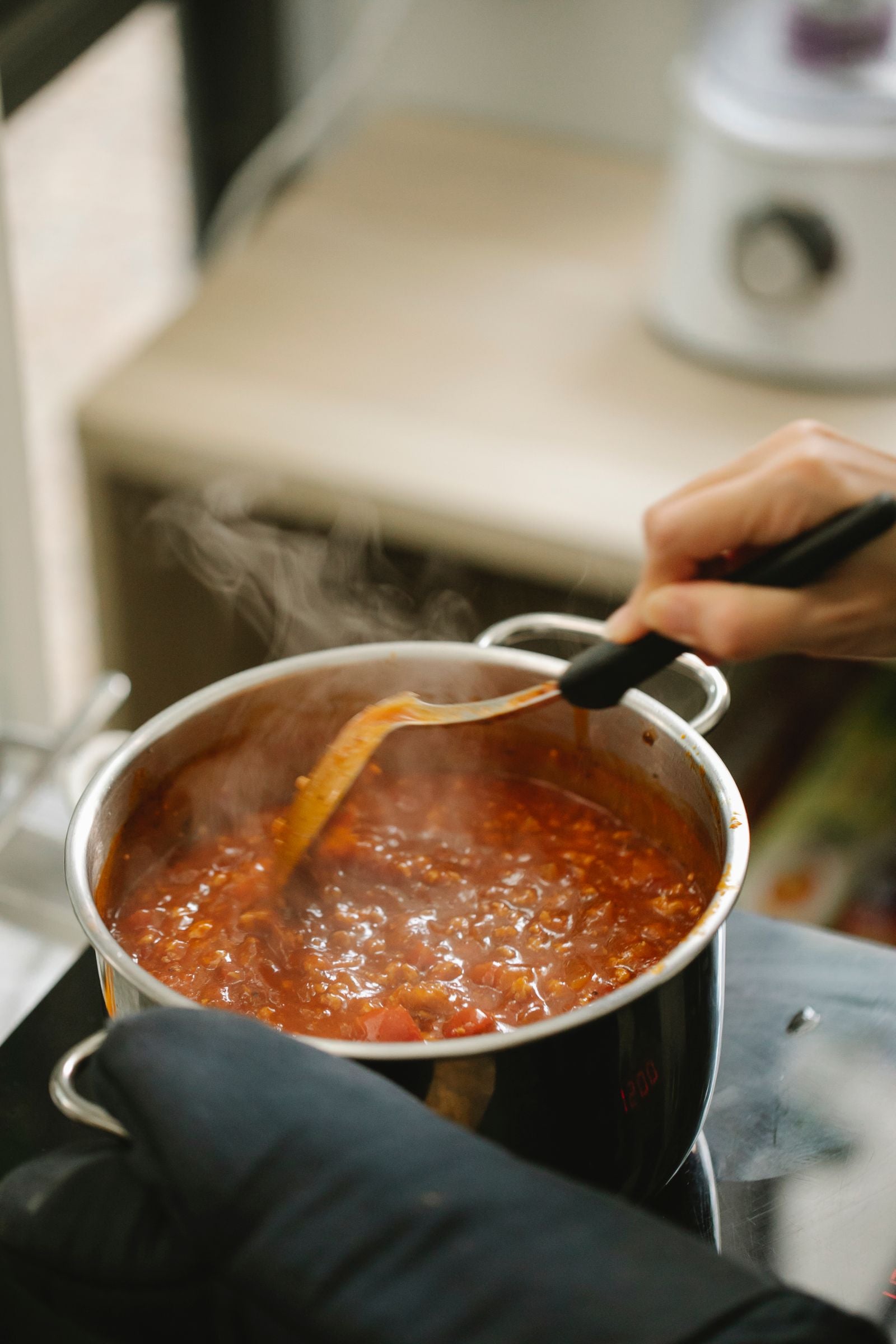 A pot of food simmering on the stovetop at home